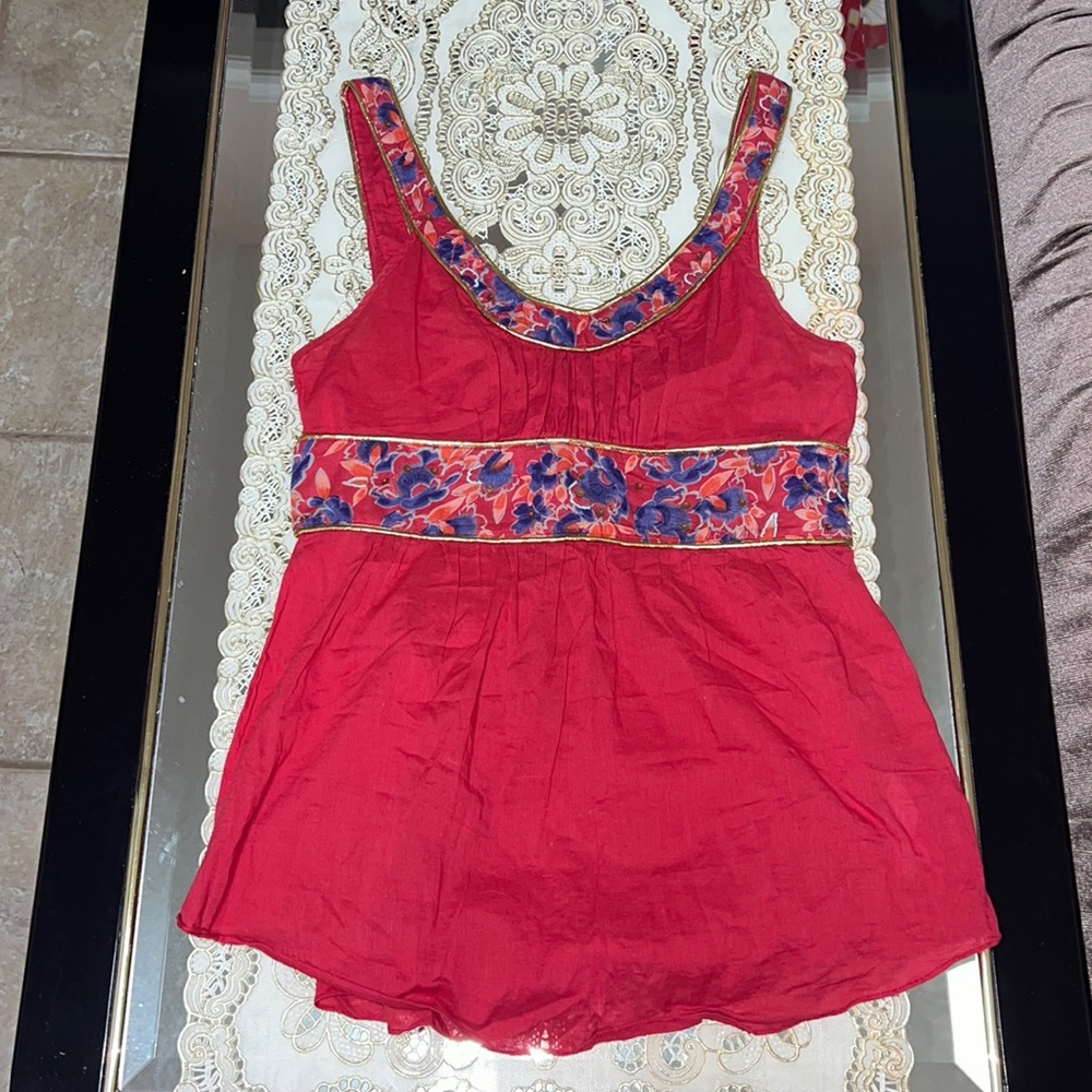 Free People red sleeveless blouse with floral accents